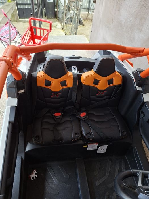 Masinuta UTV electric Premier 4x4 Can-Am Maverick Power RC, 2 locuri, 2 baterii 24V, roti cauciuc EVA, scaun piele ecologica, portocaliu