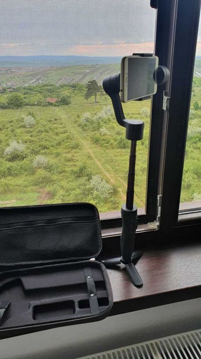 Stabilizator Ghimbal telefon, Feiyu-Tech, 3 axe, pentru stabilizare foto si video, cu braț telescopic și trepied, ca NOU