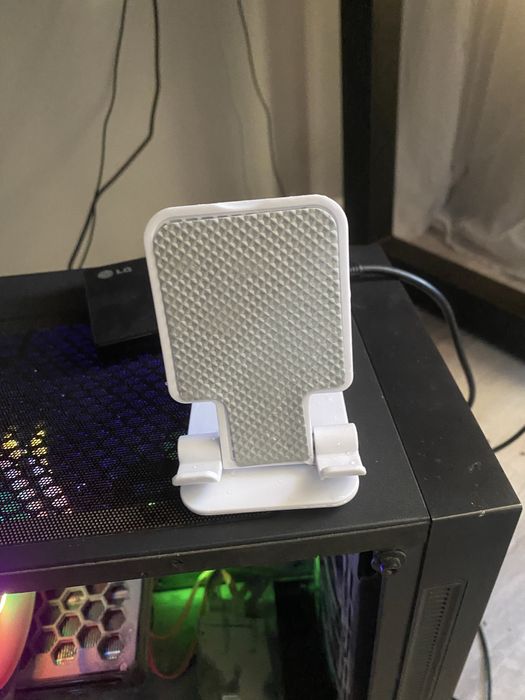 Подставка для телефона джостика.