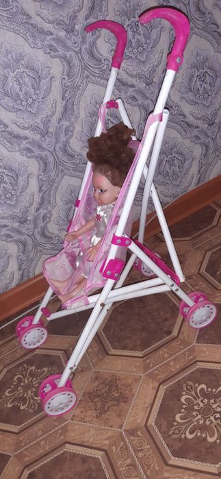 Коляска розового цвета