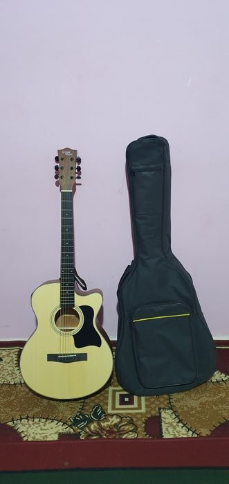 Gitara акустика holati alo ajoyib ovozi bor