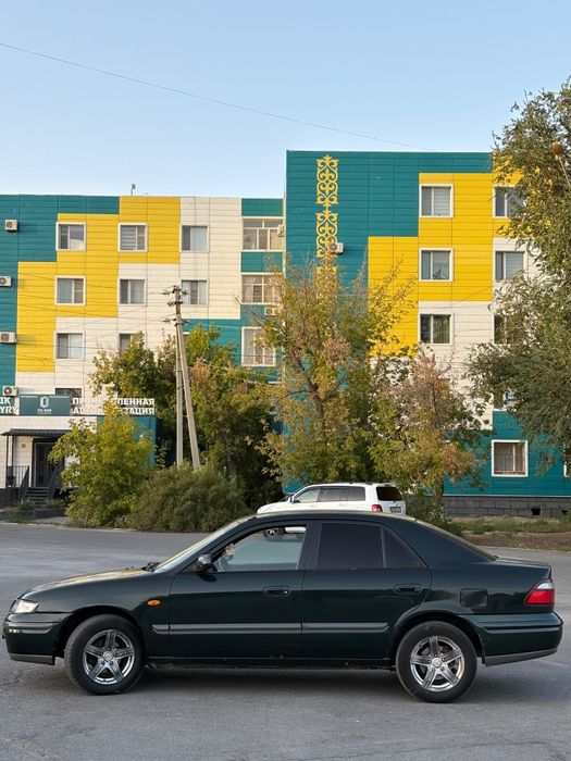 Мазда 626 птичка