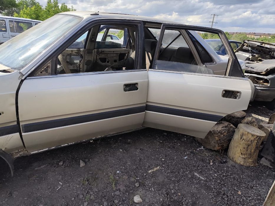 Двери Мазда 626 90год