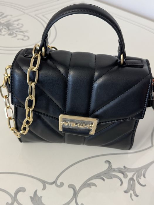 Сумка от бренда “Valentino”