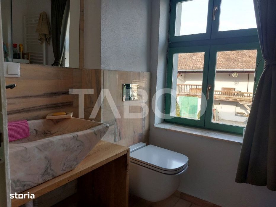 Apartament de vanzare 105 mp 3 camere curte 340 mp in acte Cisnadie