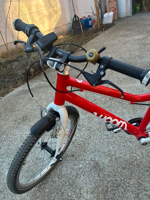 bicicletă Woom 4, roșie, apărători, lumini, sonerie