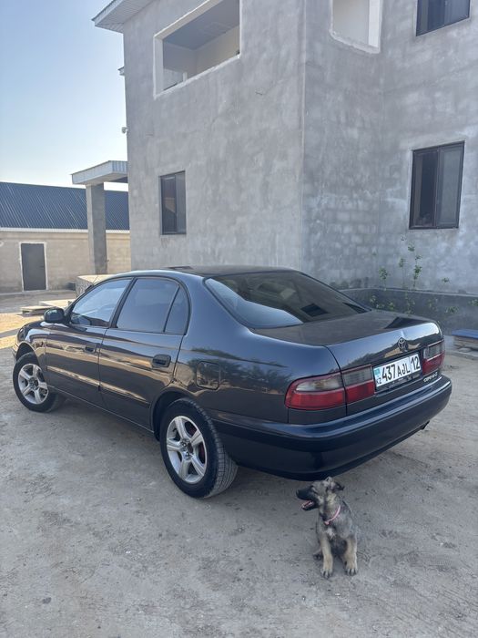 Тойота карина Е