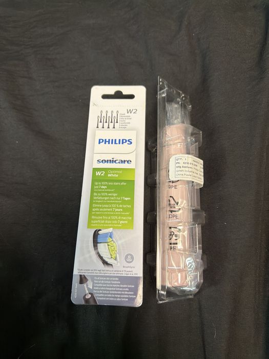 Pachet Philips Sonicare: Periuță electrică roz + Set 8 capete rezerve