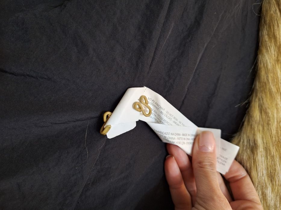 Vesta blana artificiala