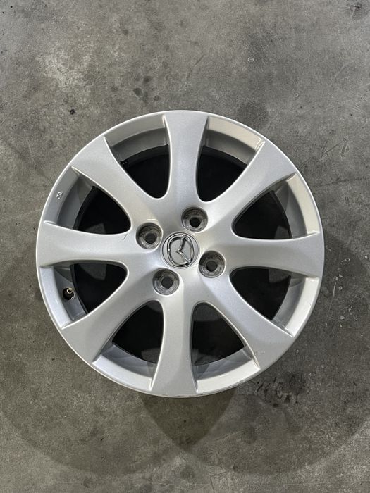 Set 4 jante aliaj 15  4x100 Originale Mazada Demio