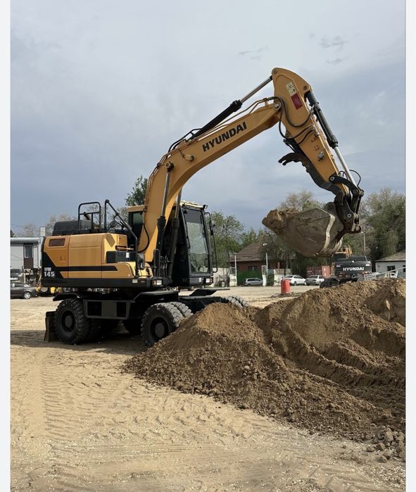 Экскаватор.Услуги колесных Экскаваторов