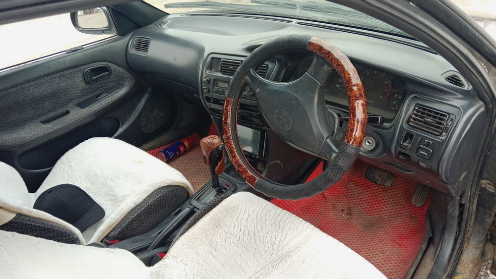 Тайота каролла ае 100