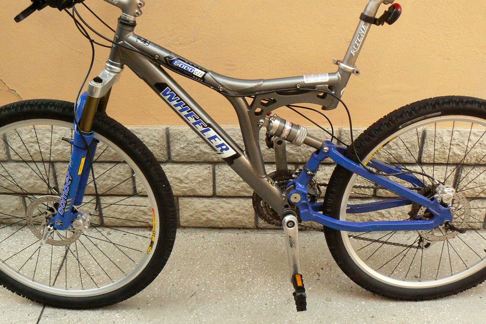 Bicicleta mountain bike full suspensie Wheeler