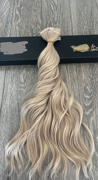 O bijuterie 4 bucati extensi de par blond clip on 50 cm pret 250 lei