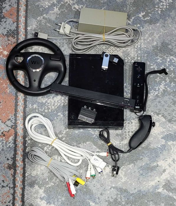 Consola Wii modata + 125 jocuri ( Mario - Wii Sport - Wii Play)+ Volan