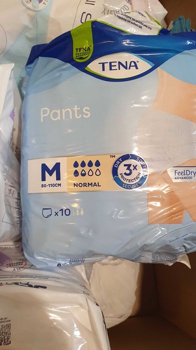 Scutece pentru adulți şi lenjerie de pat impermeabilă