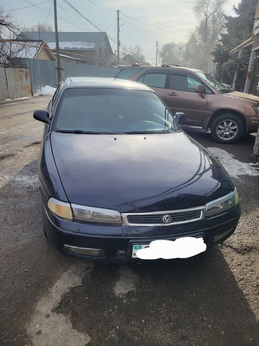 Автомобиль мазда кронос