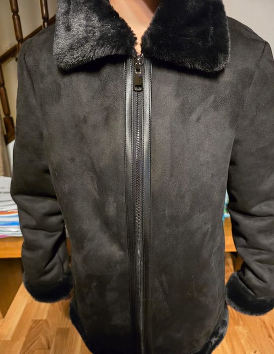 Haină din blană ecologică nouă.