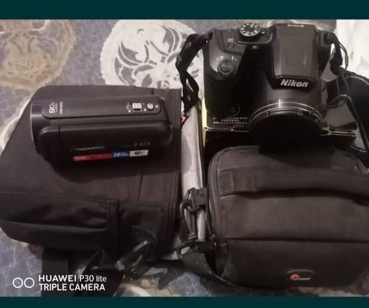 Видеокамера, фотоаппарат, штатив.