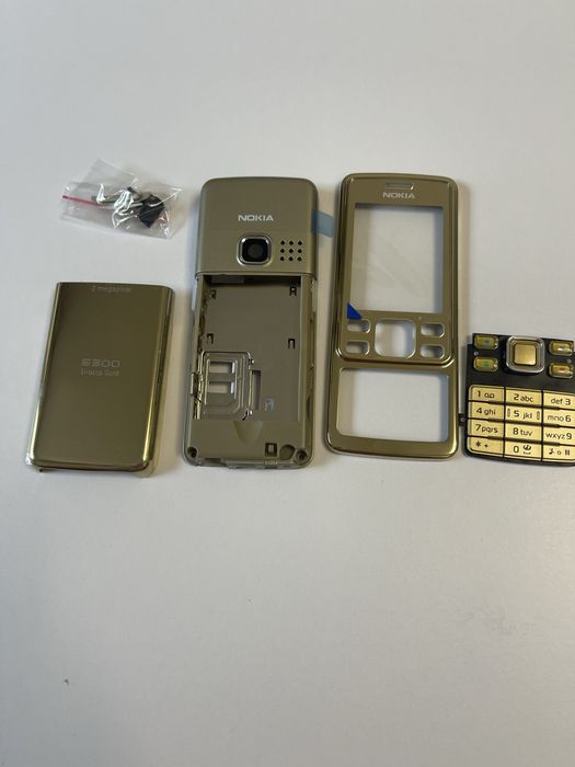 Vând carcasa Nokia 6300 Sirocco Gold