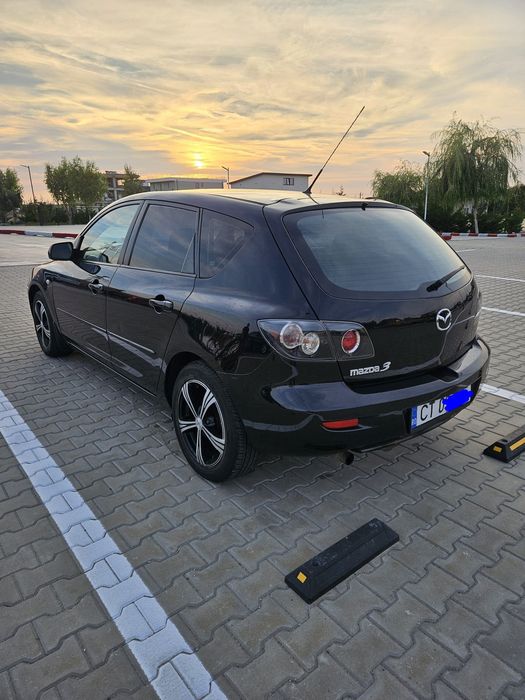 Vând mazda 3  Hatchback motor 1.3 benzina  an 2008