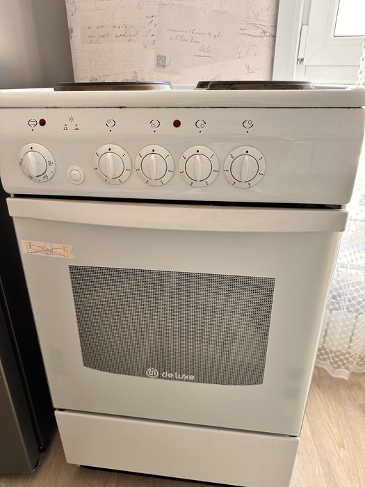 Электрическая плита с духовкой