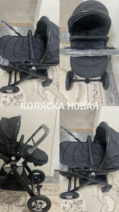 Новая коляска чёрного цвета