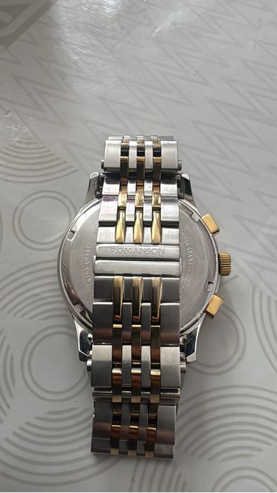 Продам  часы романсон