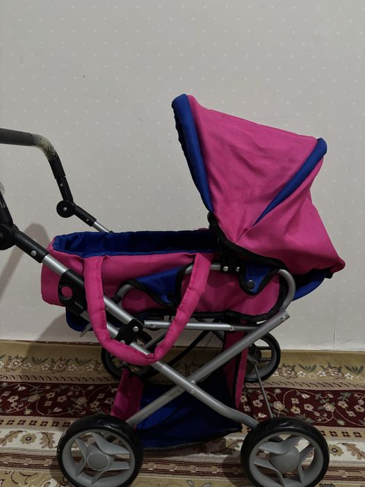 Игрушечная коляска розовая