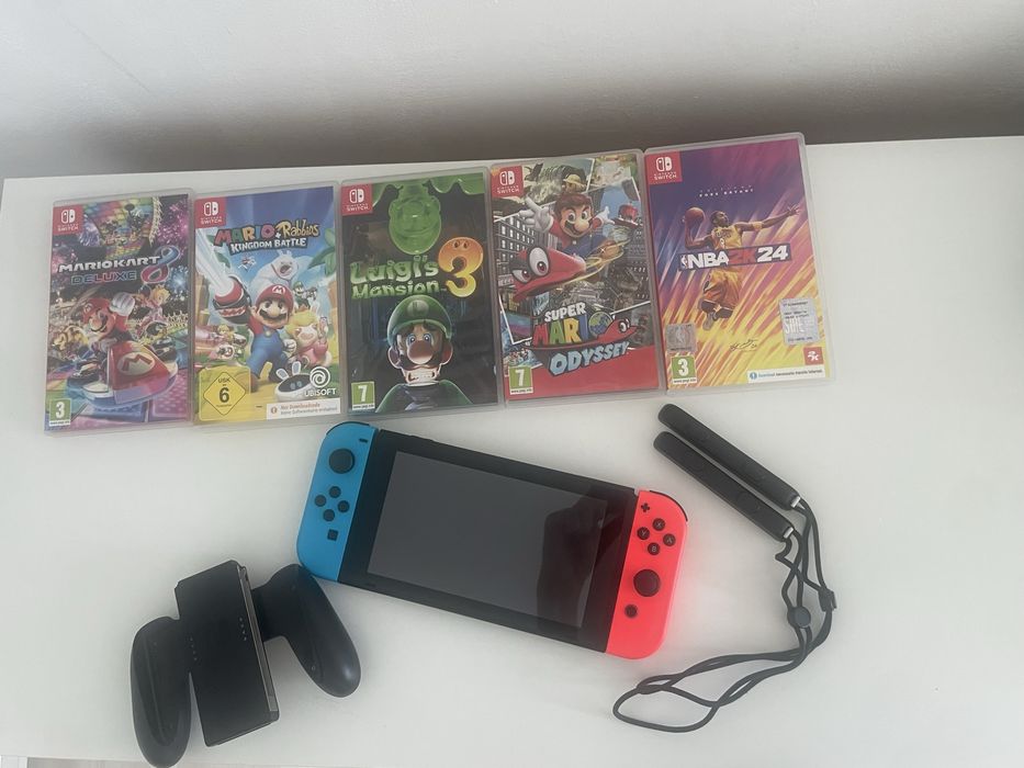 Consolă Nintendo Switch + 5 Jocuri Fizice (Pachet Complet)