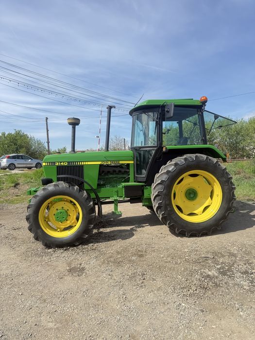 Vand sau schimb tractor John Deere 3140