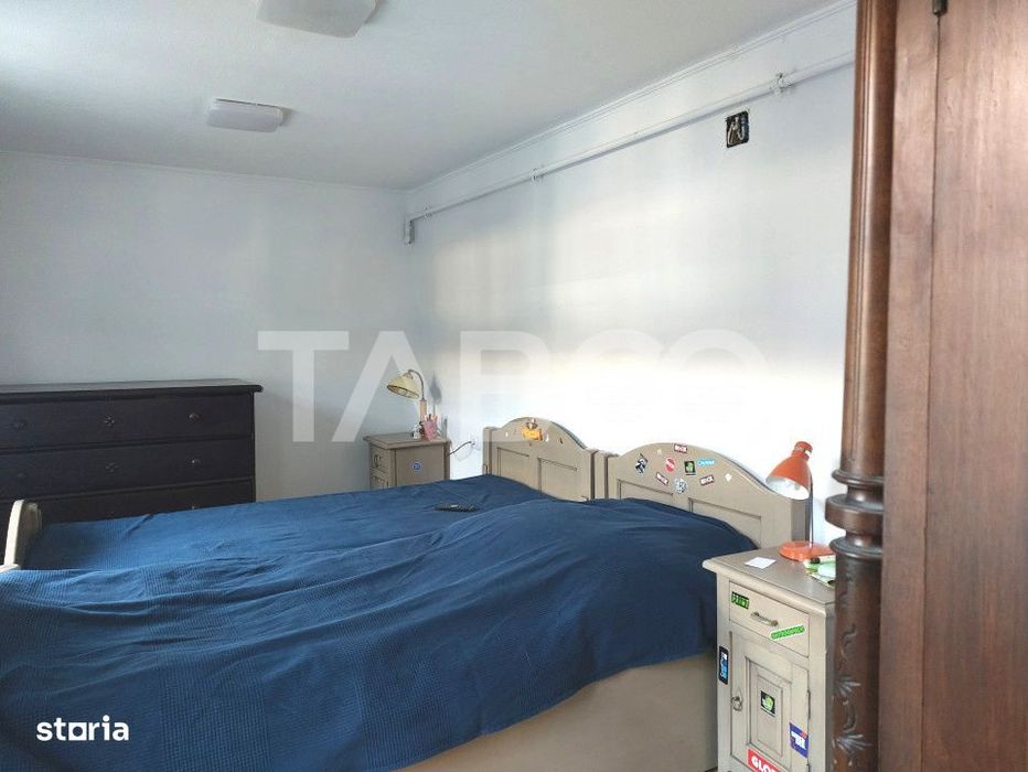 Apartament de vanzare 105 mp 3 camere curte 340 mp in acte Cisnadie