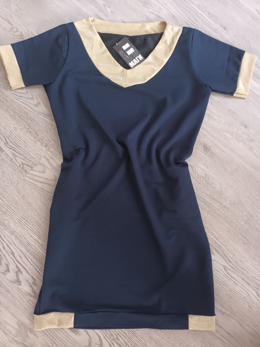 Рокля нова размер XL цвят тъмно синя. Роклята е нова с етикет.