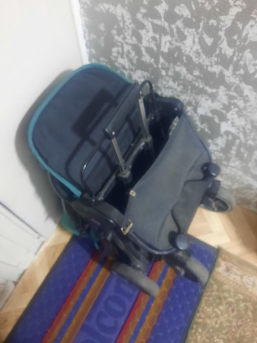 Продам коляску бирюза