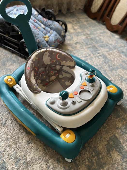 Продам коляску и ходунок