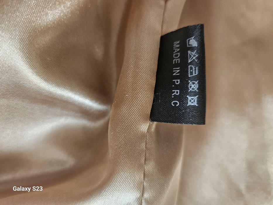 Vesta blana artificiala.100 lei