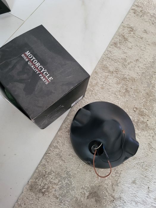 Far moto H4 cu bec pozitie nou