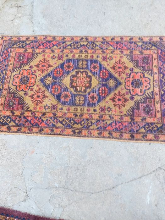 Шерстяной коврик в отличном состоянии, размер 1,40 × 80