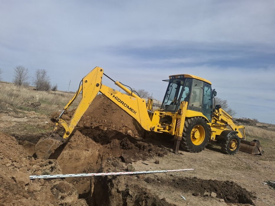 Услуга аренда экскаватор-погрузчика