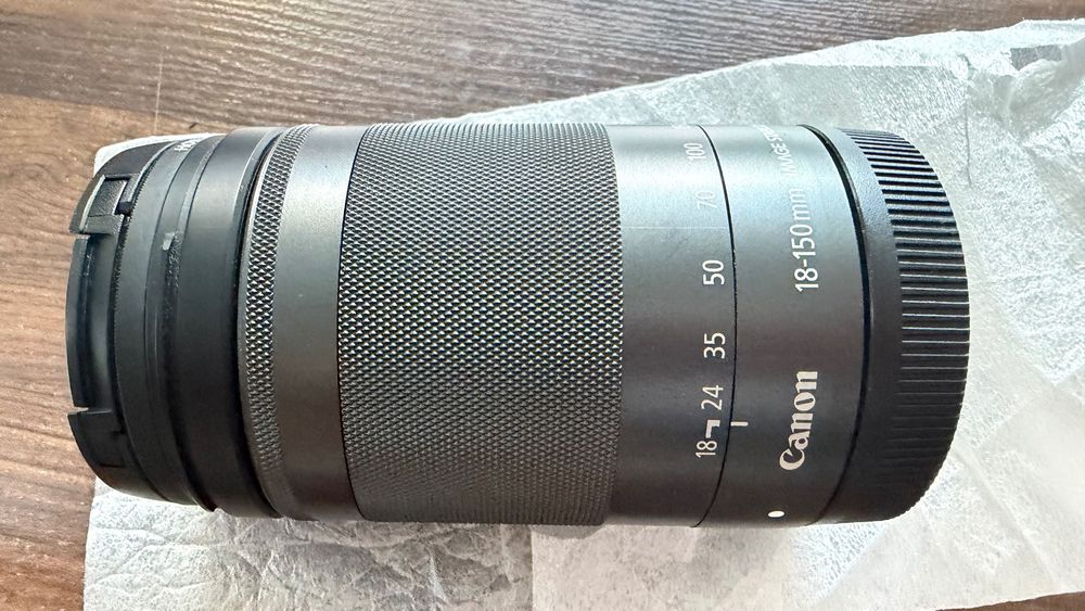 Canon EF-M 18-150mm IS STM pentru EOS M — cu filtru Hoya, stare excelentă