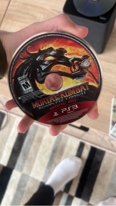 Геймпад на PS 3 и три диска с играми