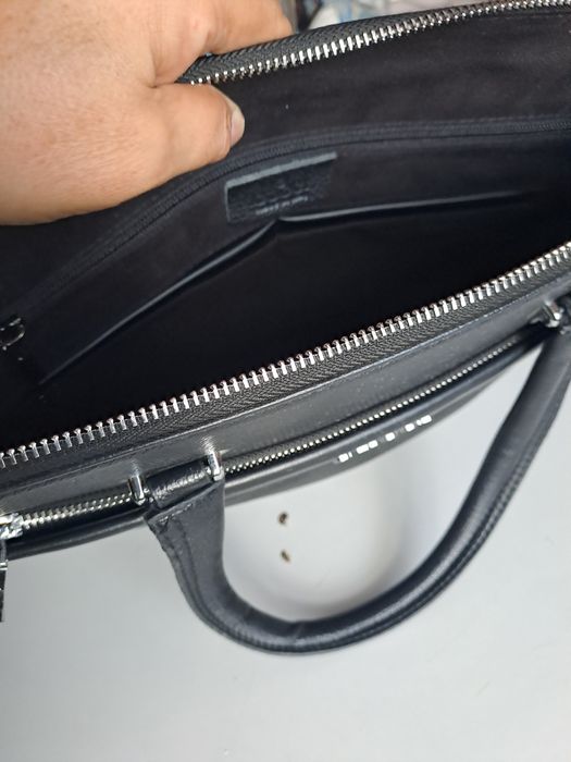 Коженный гучидың сумкасы нотбукке сатылады