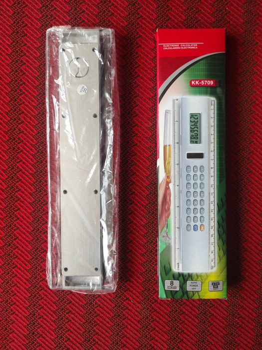 Calculator electronic cu fotocelulă și riglă în centimetri și inch