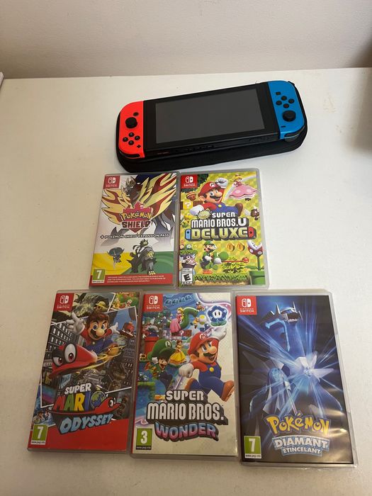 Nintendo Switch + accesorii + 5 jocuri – ca nouă
