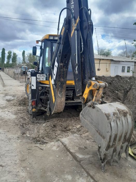 Эксковатор погрузчик MST