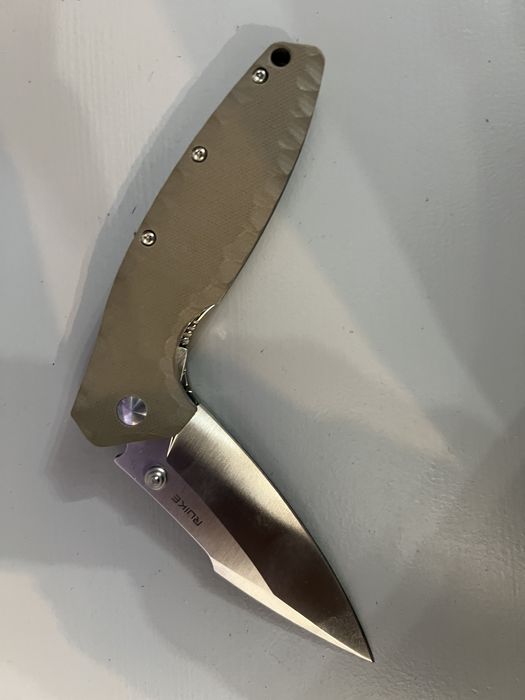 Briceag Ruike Otel inoxidabil 12C27, maner din G10