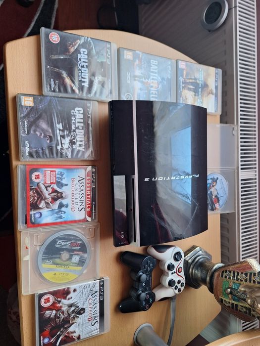 Ps 3 + doua manete si8 jocuri