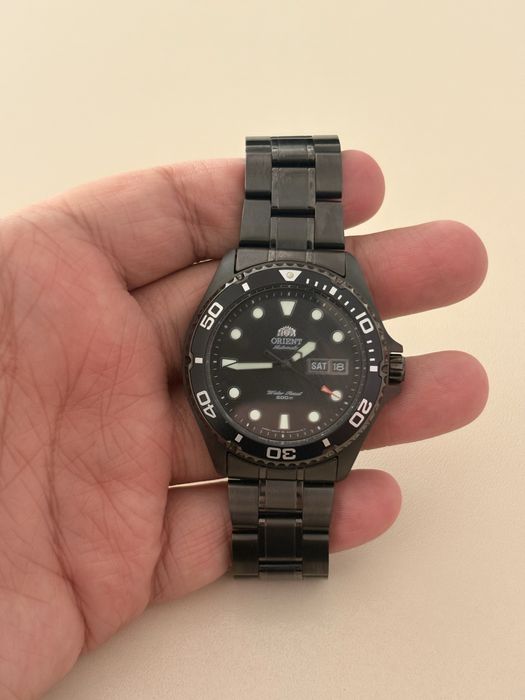 Orient Ray Raven Black PVD coated new with papers