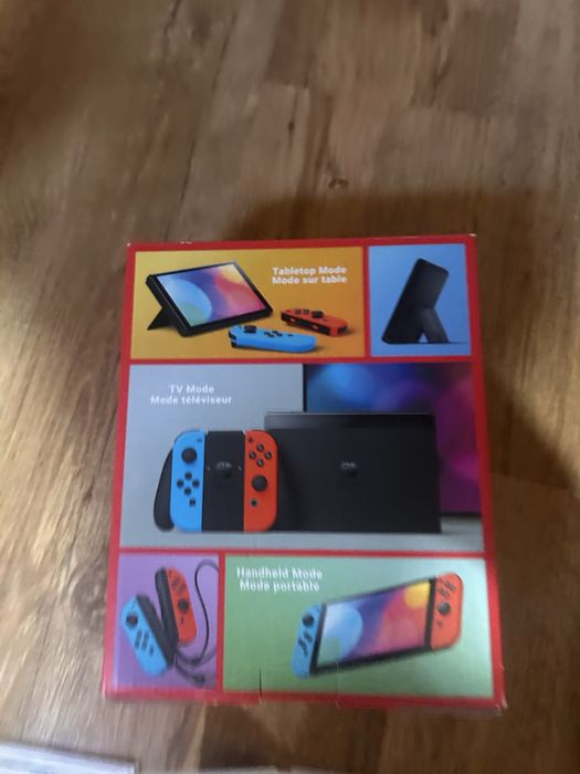 Nintendo Switch OLED + 2 jocuri + cutie + accesorii