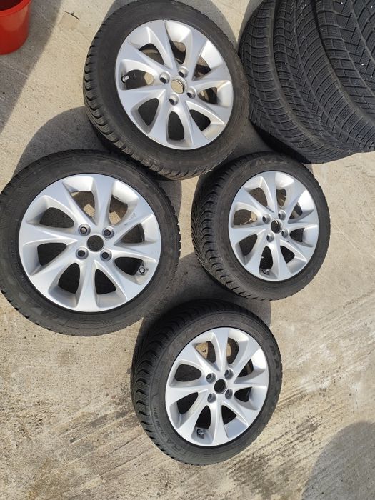 Jante aluminiu 4 X100 pe 15. Cu anvelope M+S . 185/55R15.